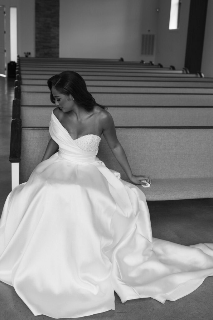 the bride in her wedding dress in the ceremony space before her wedding day