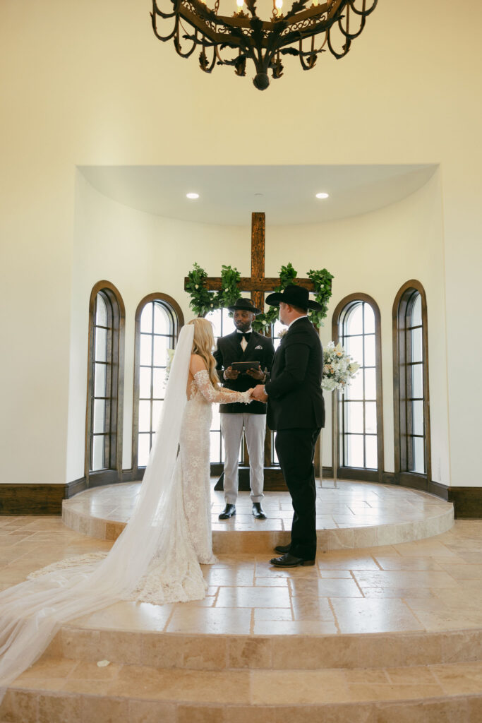 Bride and groom during their wedding ceremony at The Chapel at Palacios