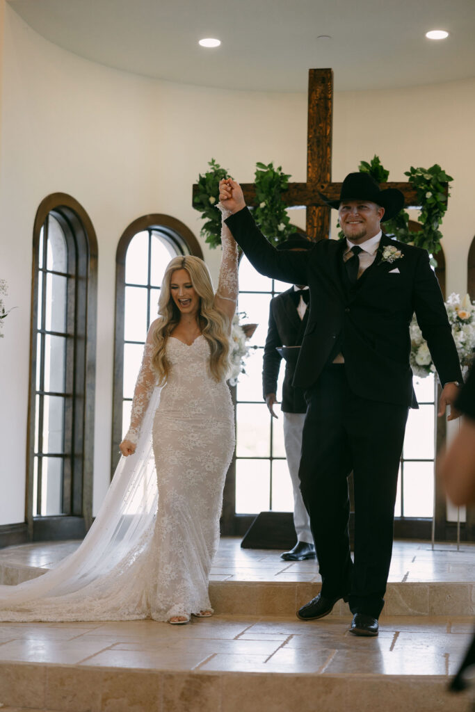 Bride and groom during their wedding ceremony at The Chapel at Palacios