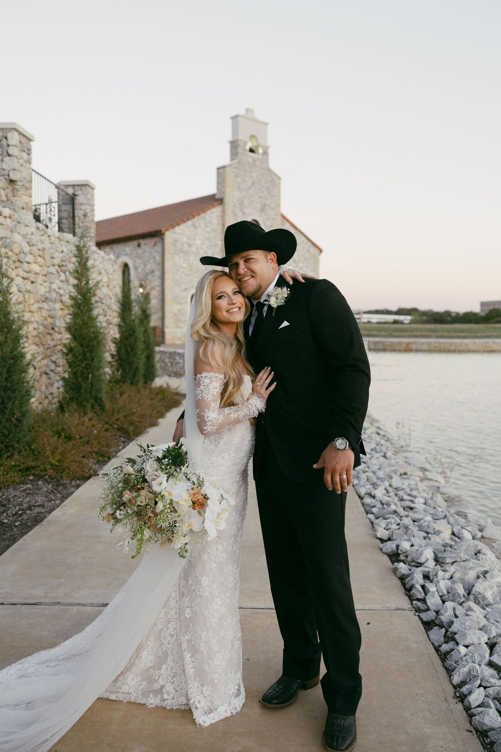 Bride and groom in front of the Chapel at Palacios in Westlake Texas