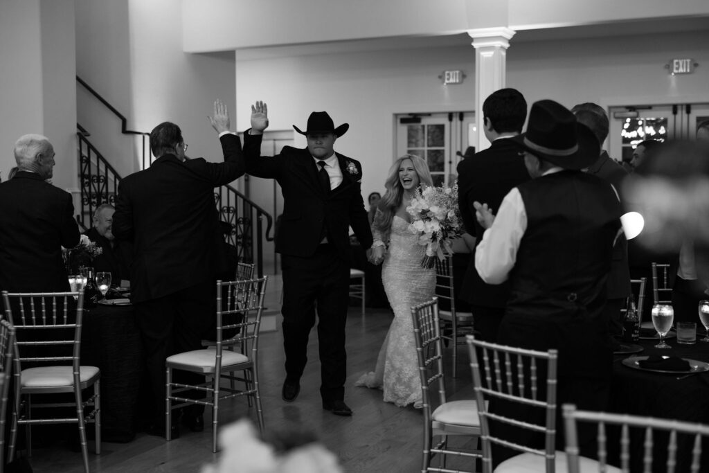 Grand entrance into their wedding reception