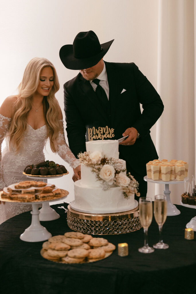 bride and groom cut their wedding cake