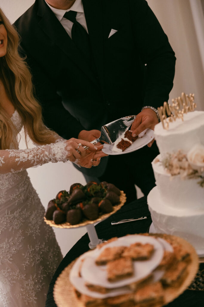 bride and groom cut their wedding cake