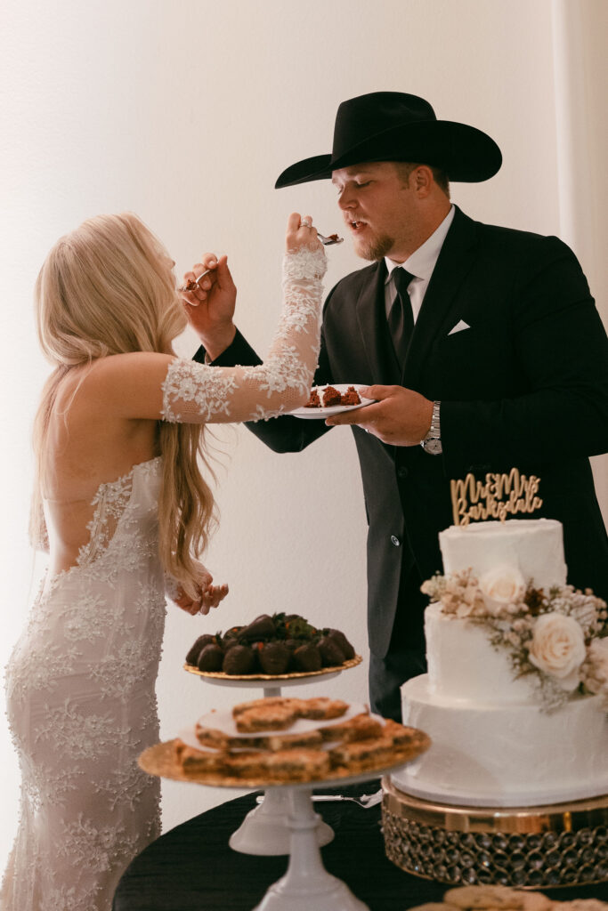 bride and groom cut their wedding cake