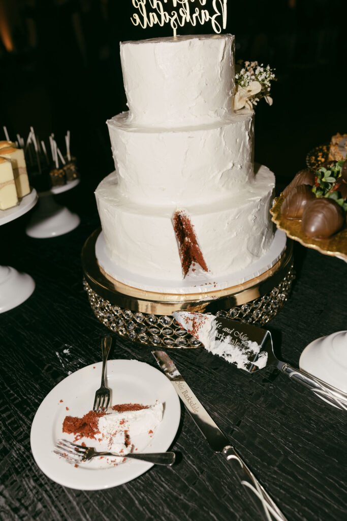 Wedding cake with a slice cut out of it