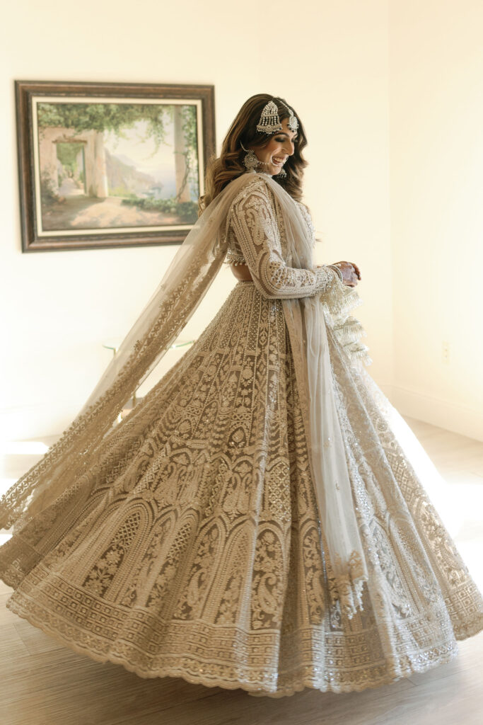 A bride spinning in her Indian bridal attire before her wedding at D'Vine Grace Vineyard