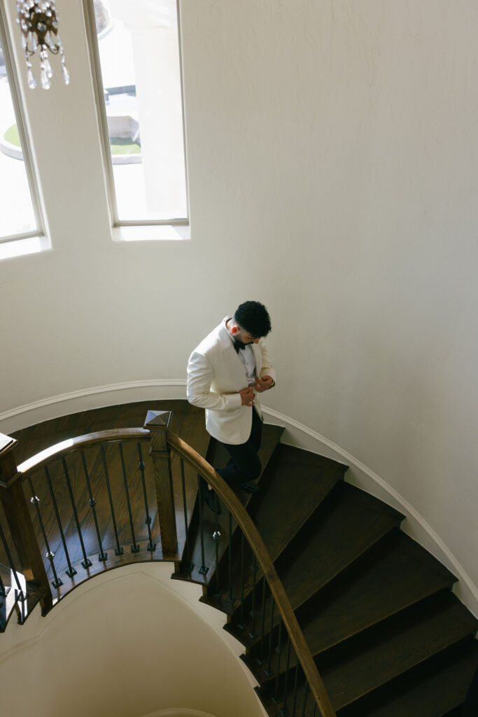 Groom walking down the stairs