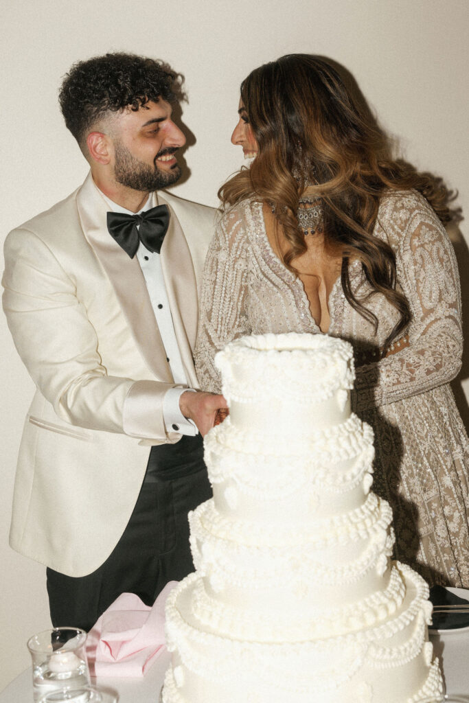 bride and groom cutting their wedding cake