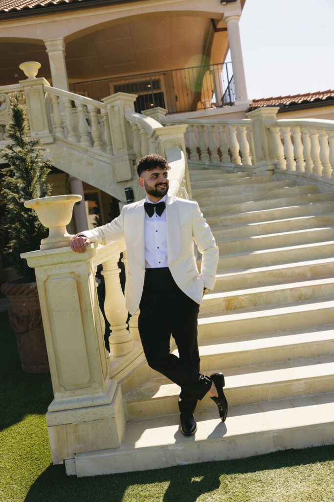 A groom standing on the steps at D'Vine Grace Vineyard