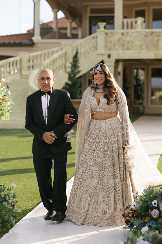 A father walking his daughter down the aisle on her wedding day