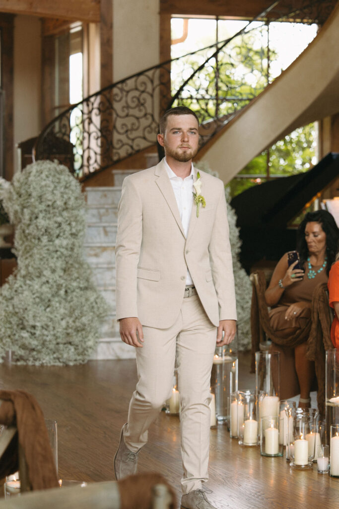 groom walking down the aisle