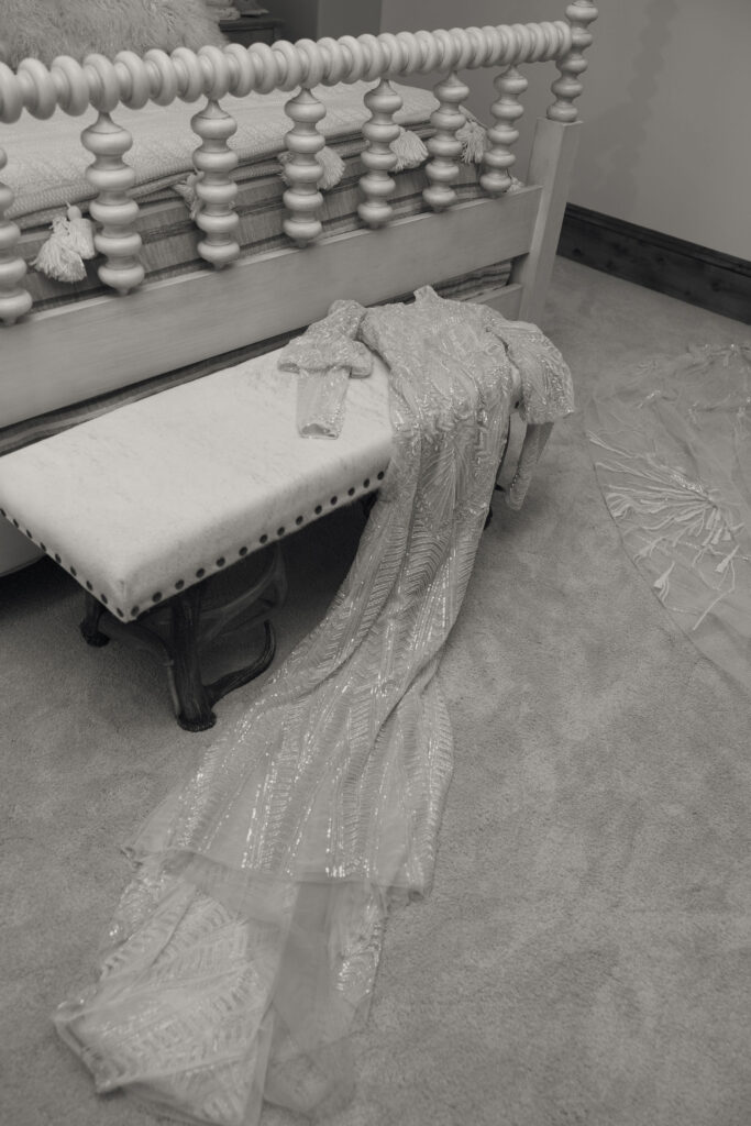 a wedding dress on a bench