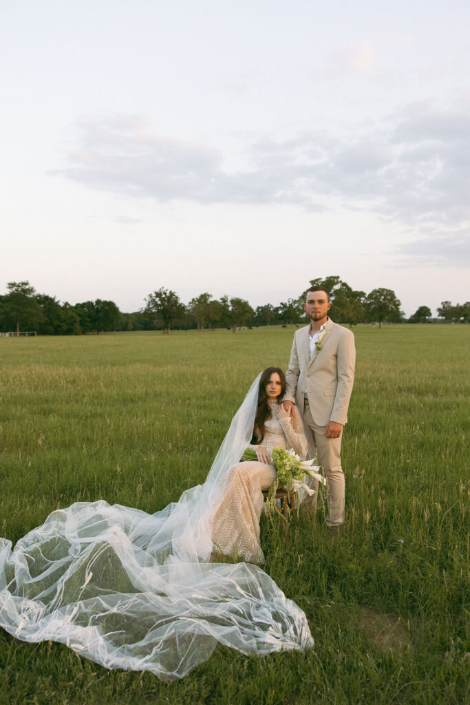Bride and groom in a field