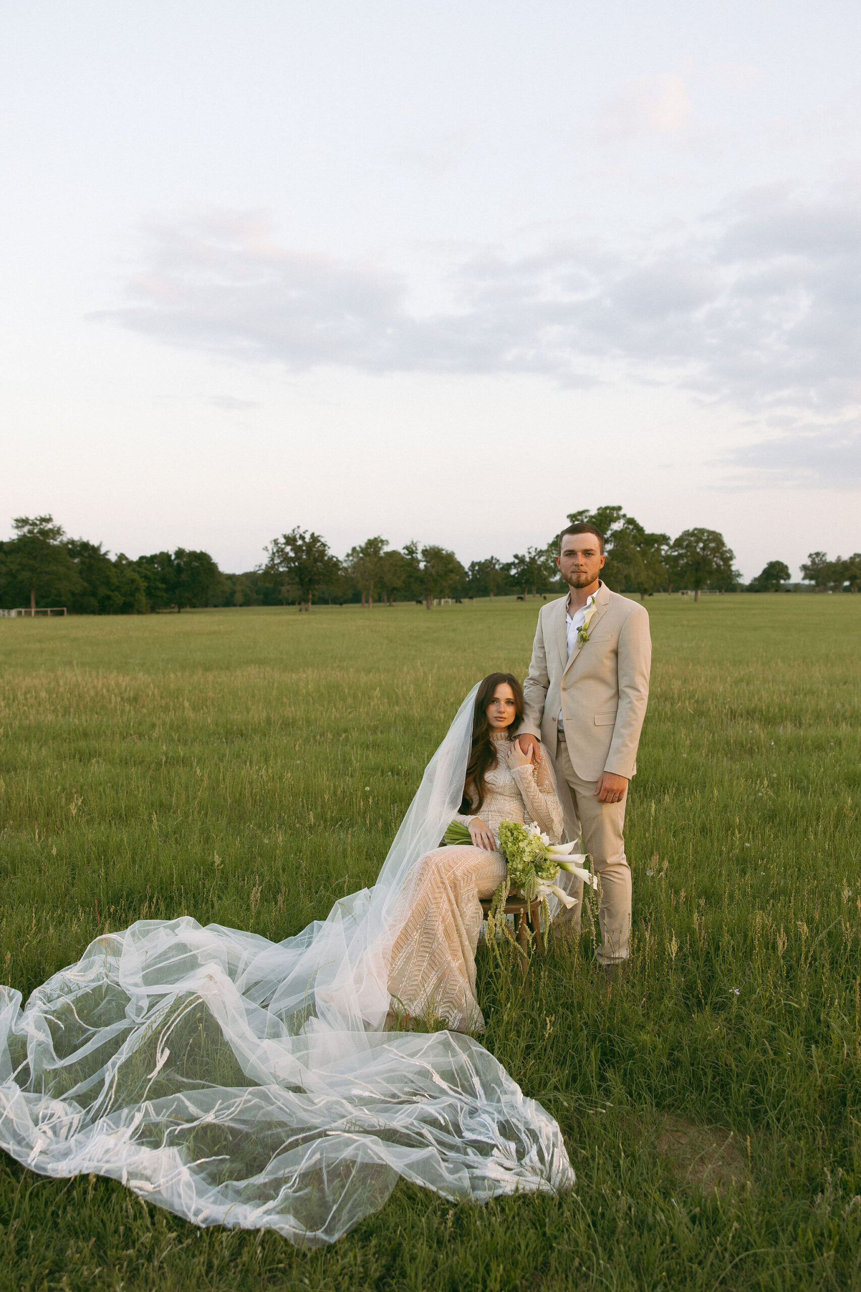 Bride and groom in a field