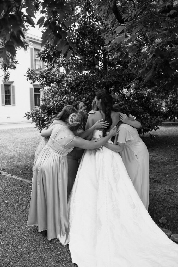 friends hugging bride