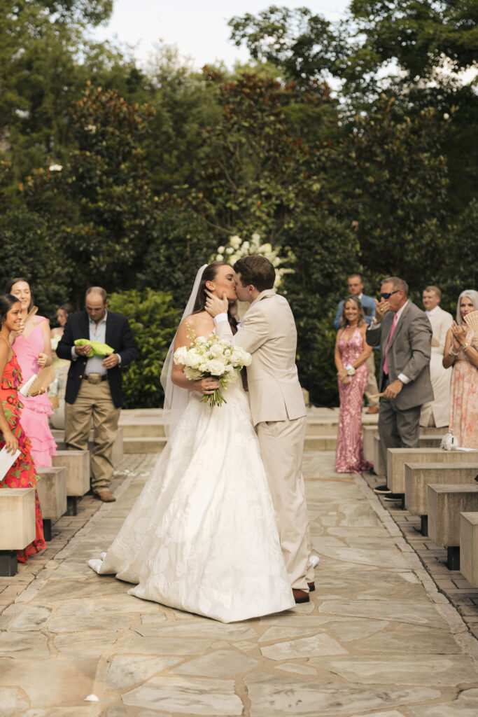 4th of july wedding in nashville bride and broom kissing