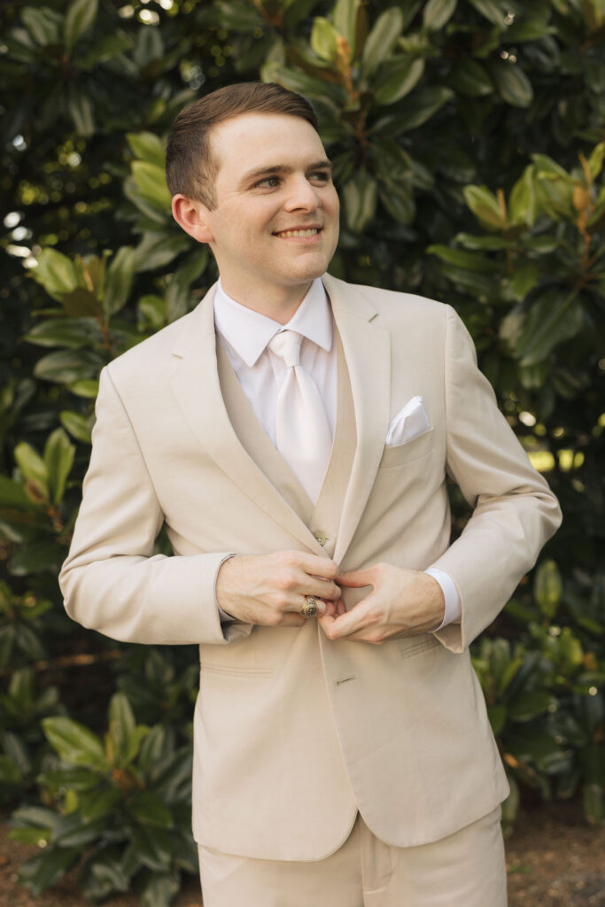 groom in tan suit in nashville