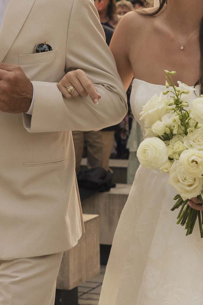 arm in arm at 4th of july wedding