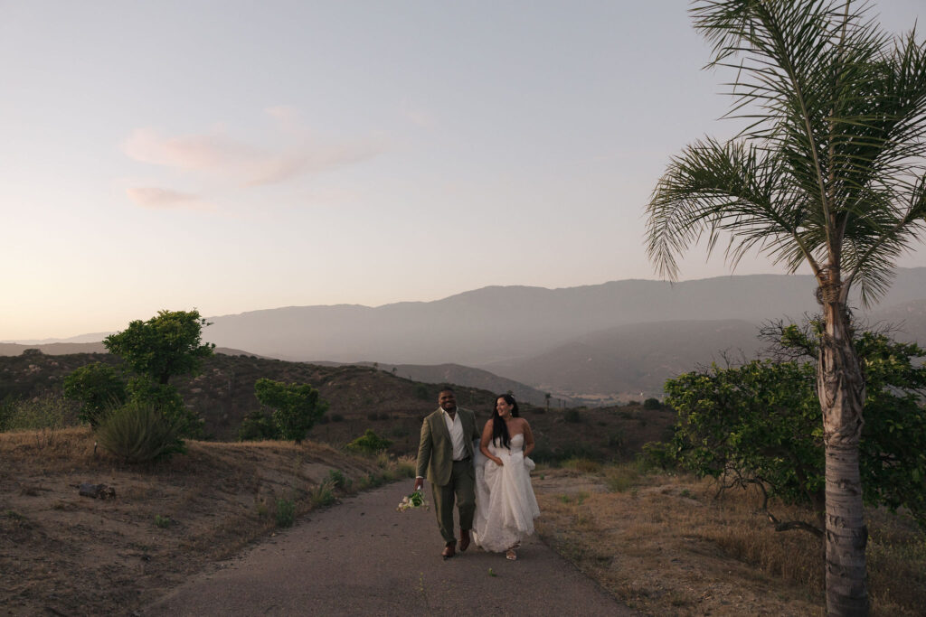 bride and groom walking in california hills