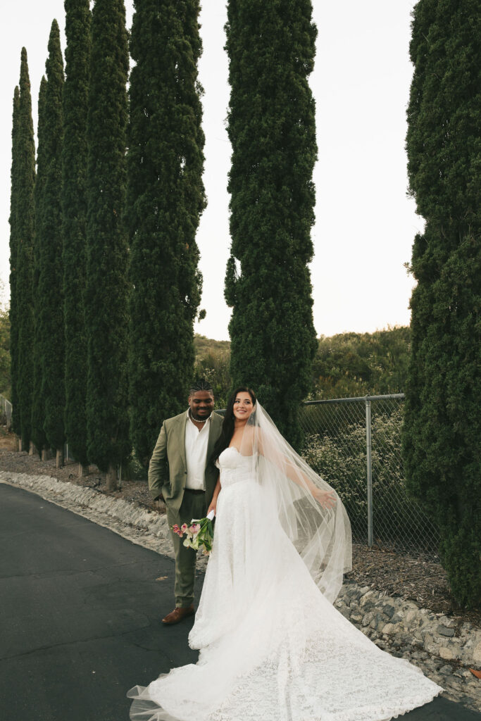 bride and groom in california with tall trees