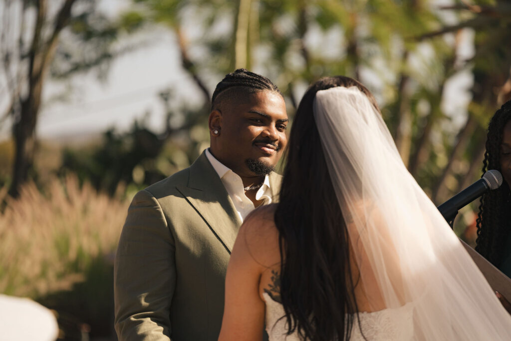 groom smiling at bride at san diego wedding