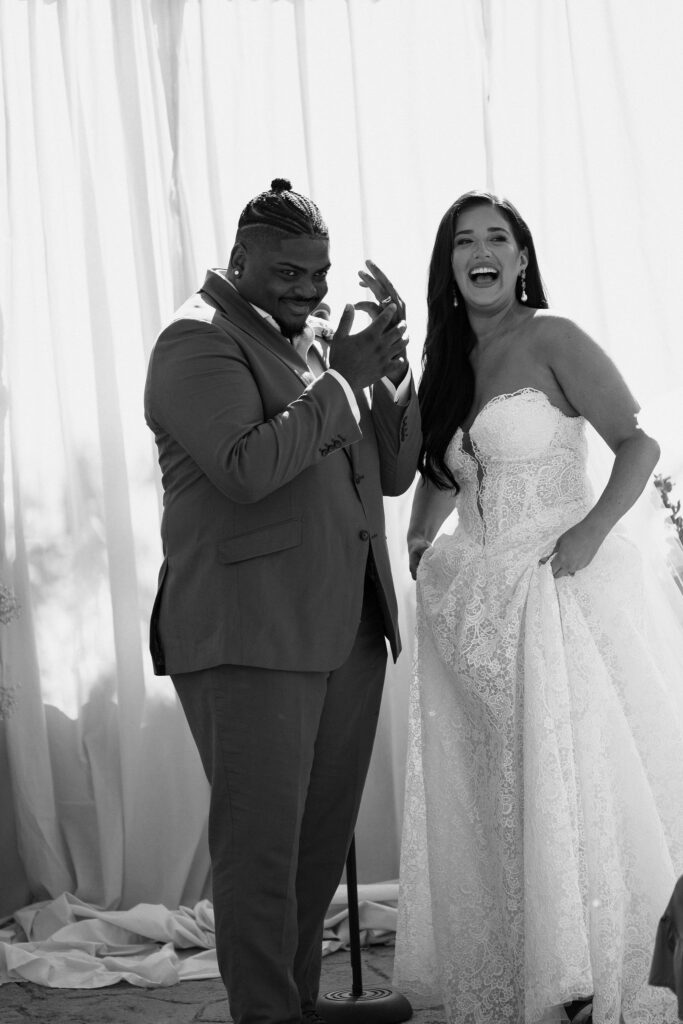 bride and groom laughing at wedding