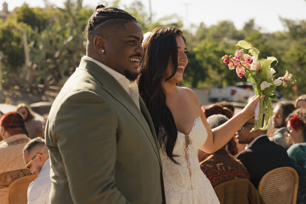 bride and groom smiling at wedding
