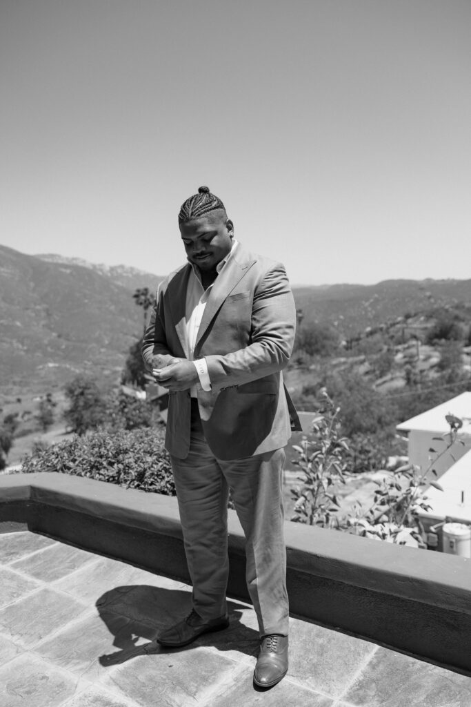 black and white photo of groom on san diego wedding day