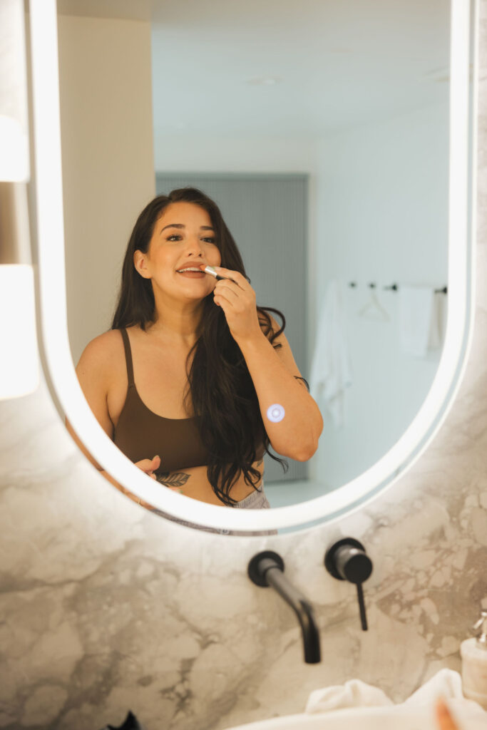 bride getting ready for wedding in mirrir