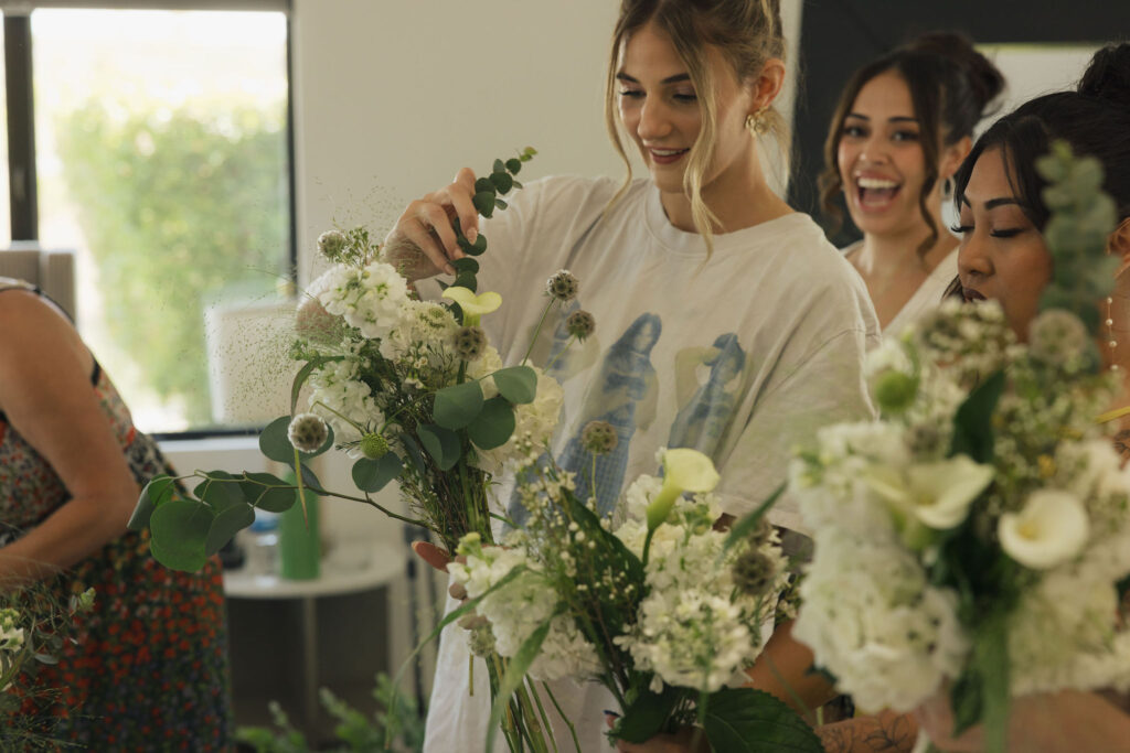 bridesmaid with flowers getting ready