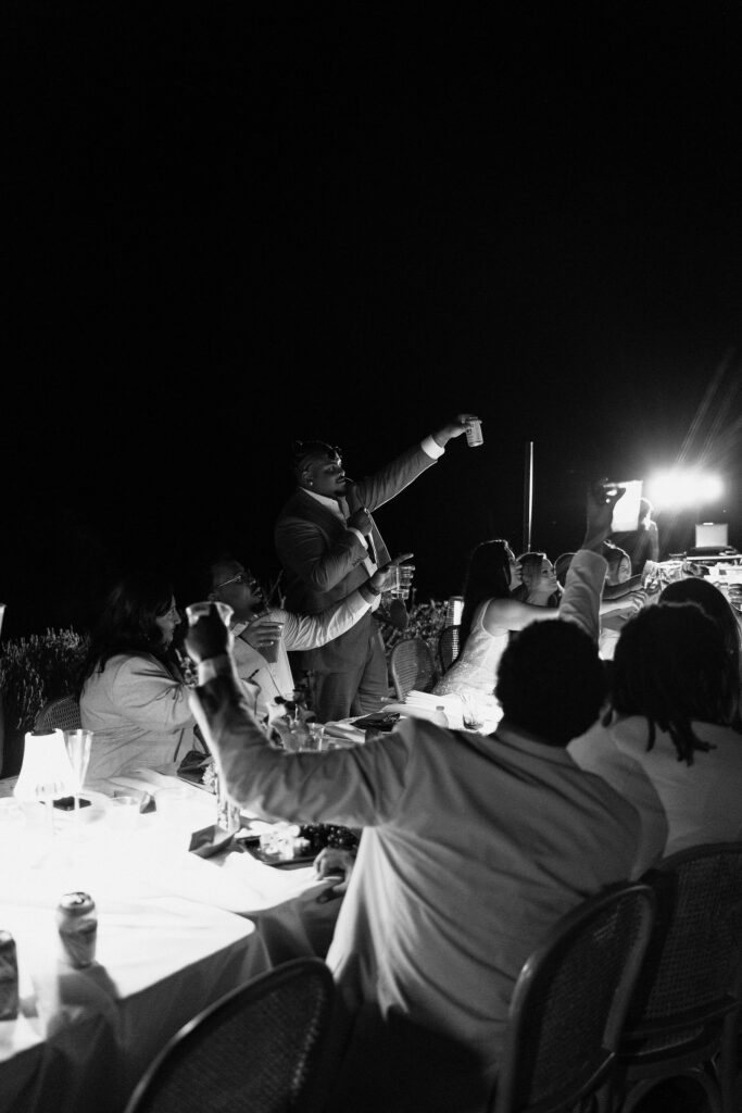 black and white image of groom standing