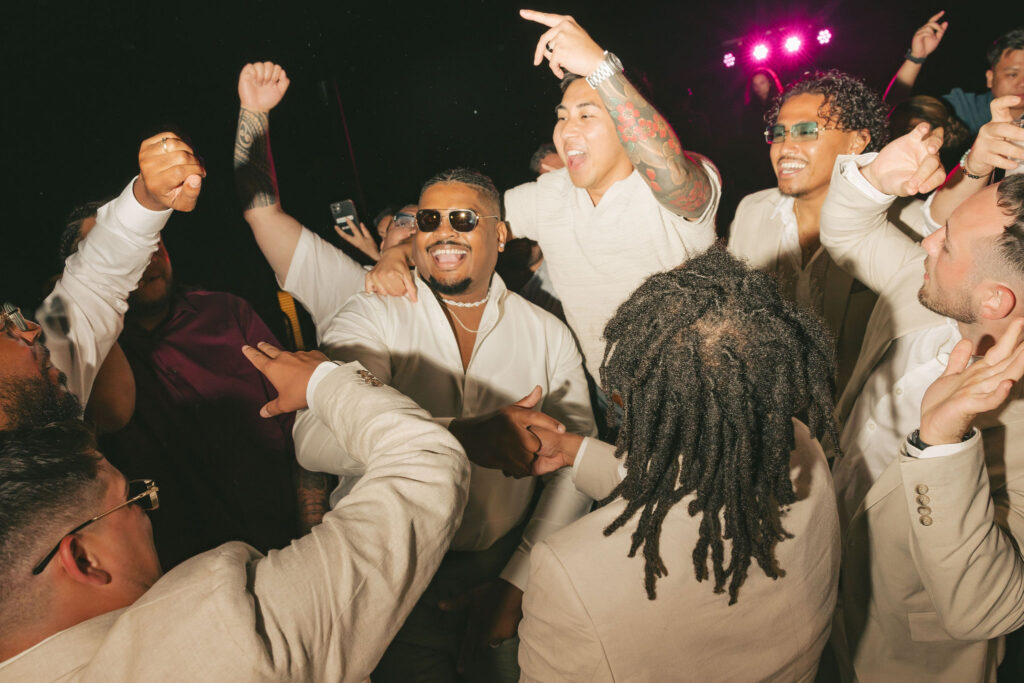 groom smiling with friends in san diego