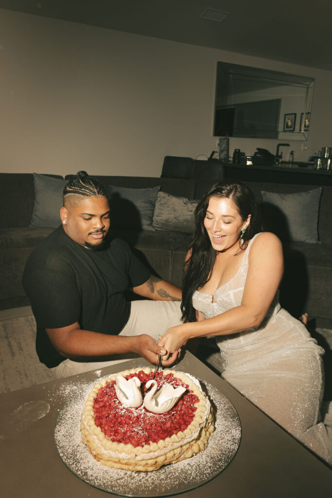 bride and groom cutting cake