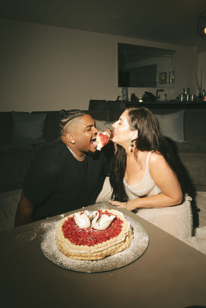 bride and groom eating cake in san diego