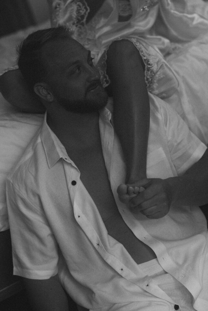 black and white photo of bride and groom in hotel