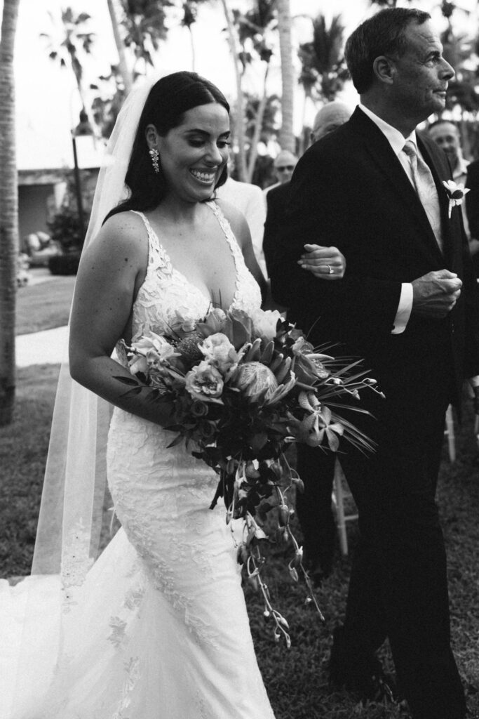 bride smiling at wedding ceremony