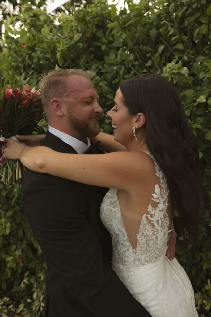 bride and groom smiling 