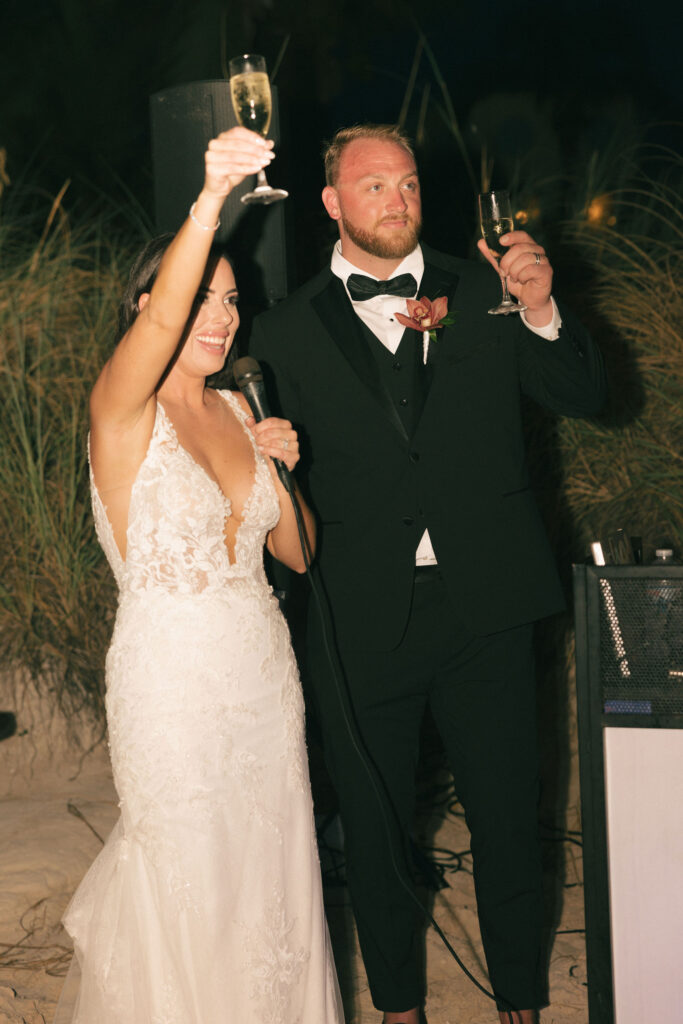 bride and groom cheers at Turks and Caicos Wedding