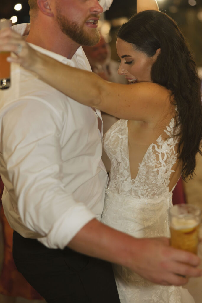 bride and groom having fun at wedding