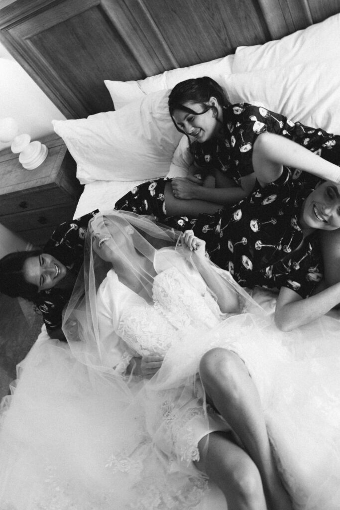 bride laughing with bridal party
