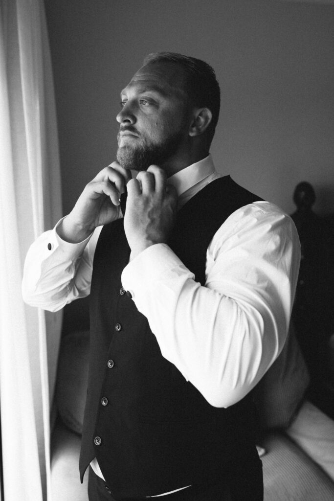groom buttoning collar