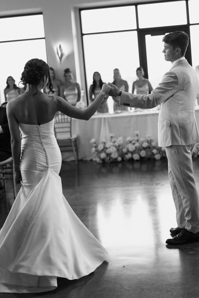 bride and groom first dance in black and white