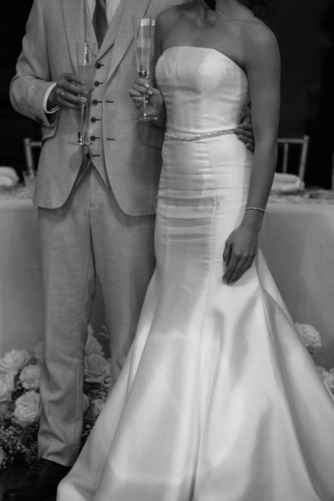 bride and groom toast at reception