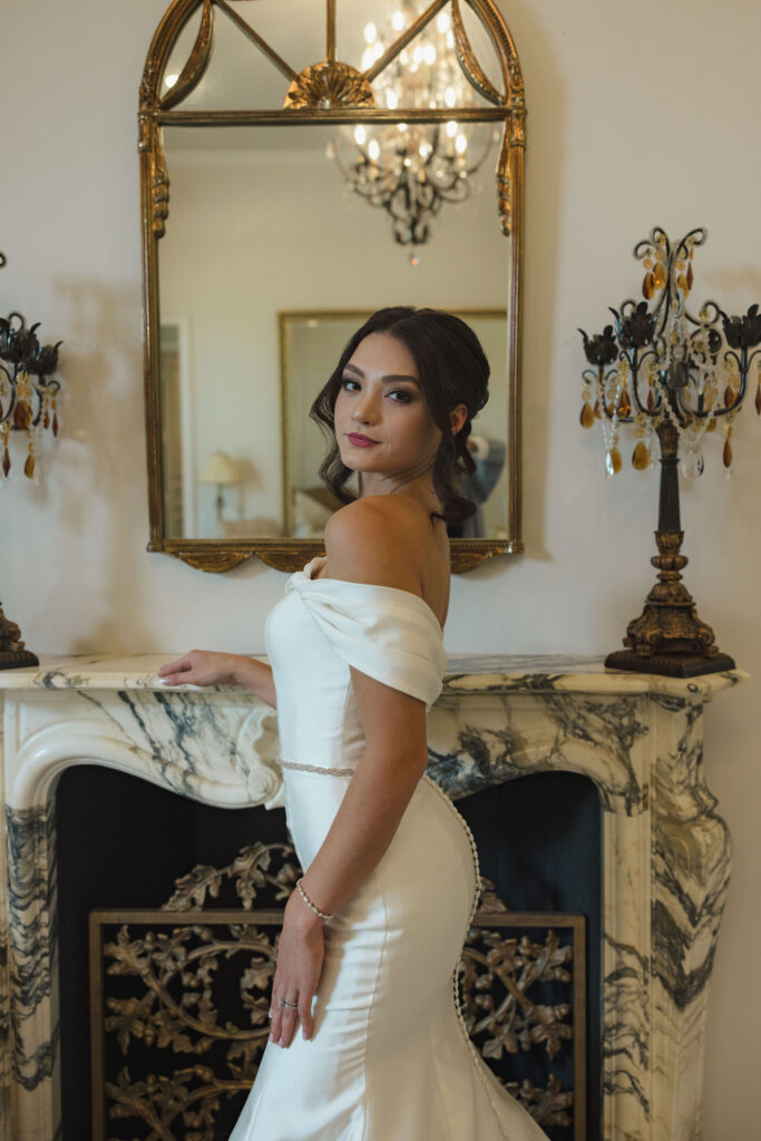 bridal portrait in front of fireplace