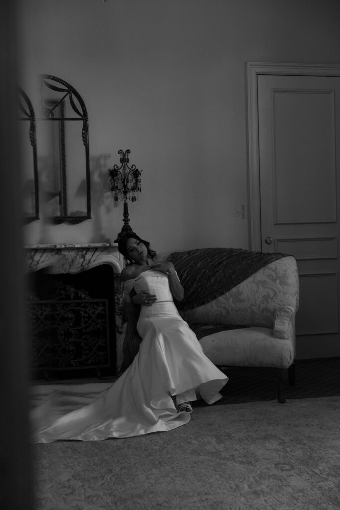 black and white image of bride on couch