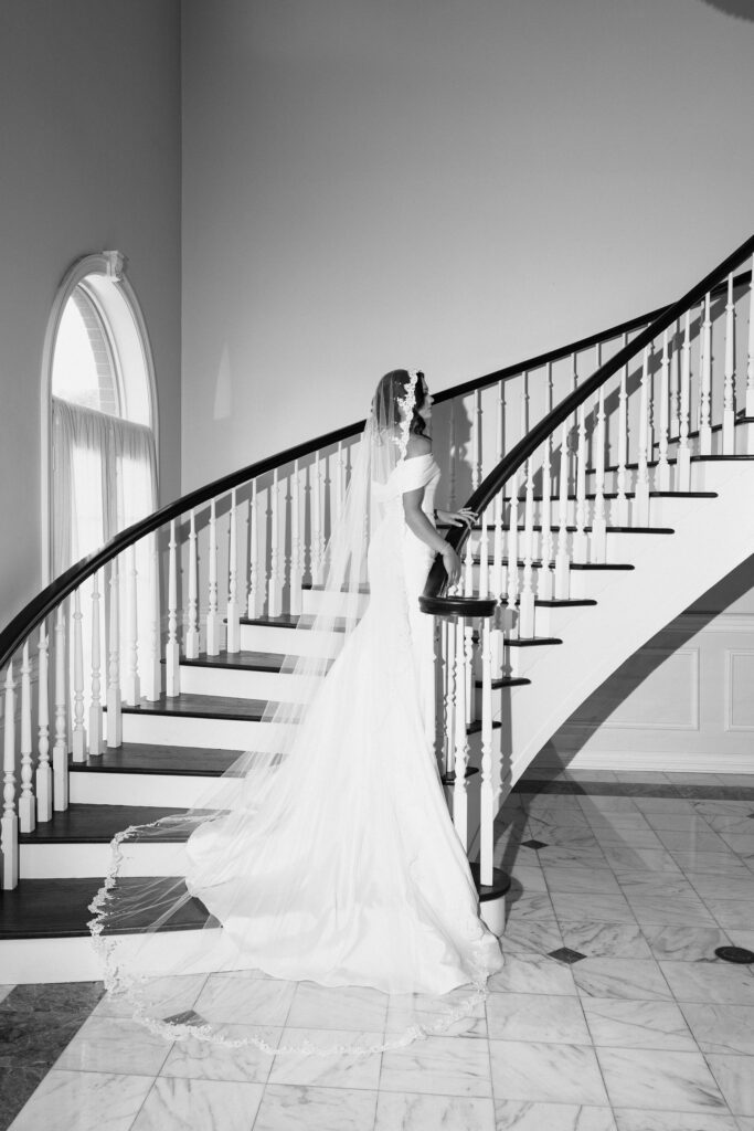 bride on stairs in wedding dress