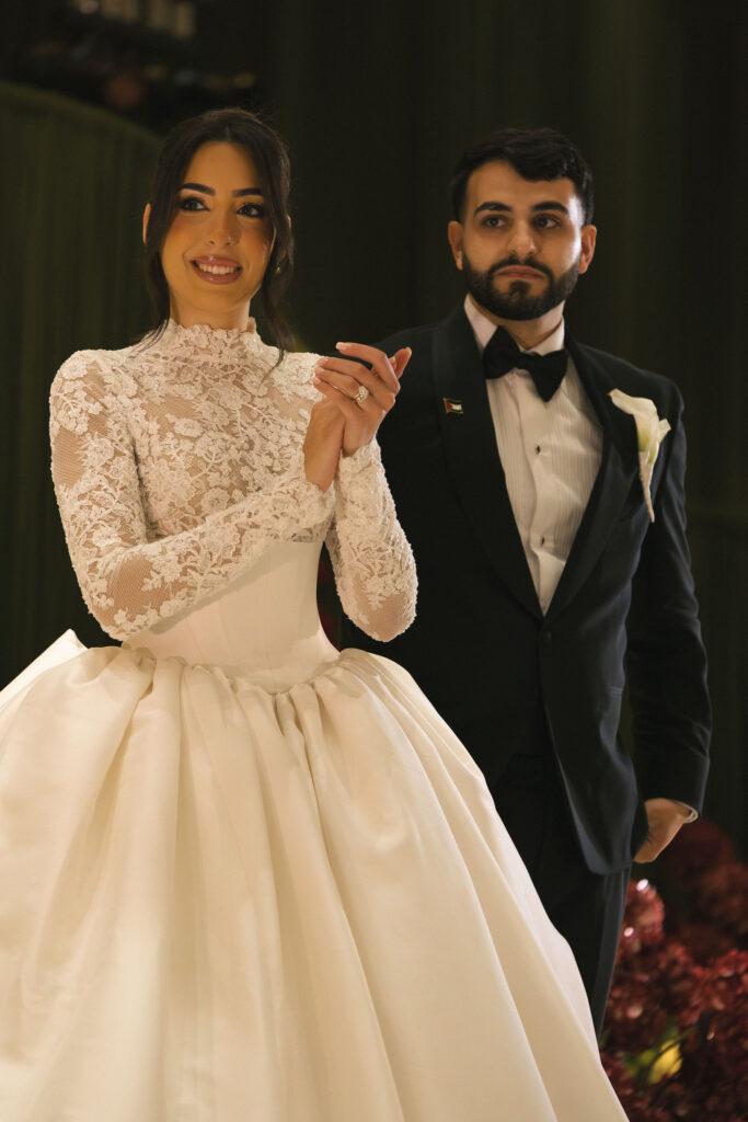 bride and groom listening to speech