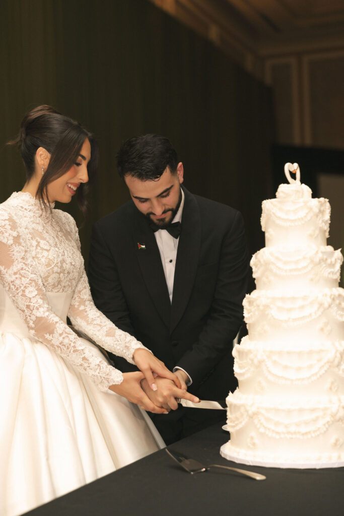 bride and groom cutting the cake