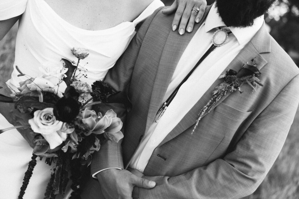 details photo of bride and groom