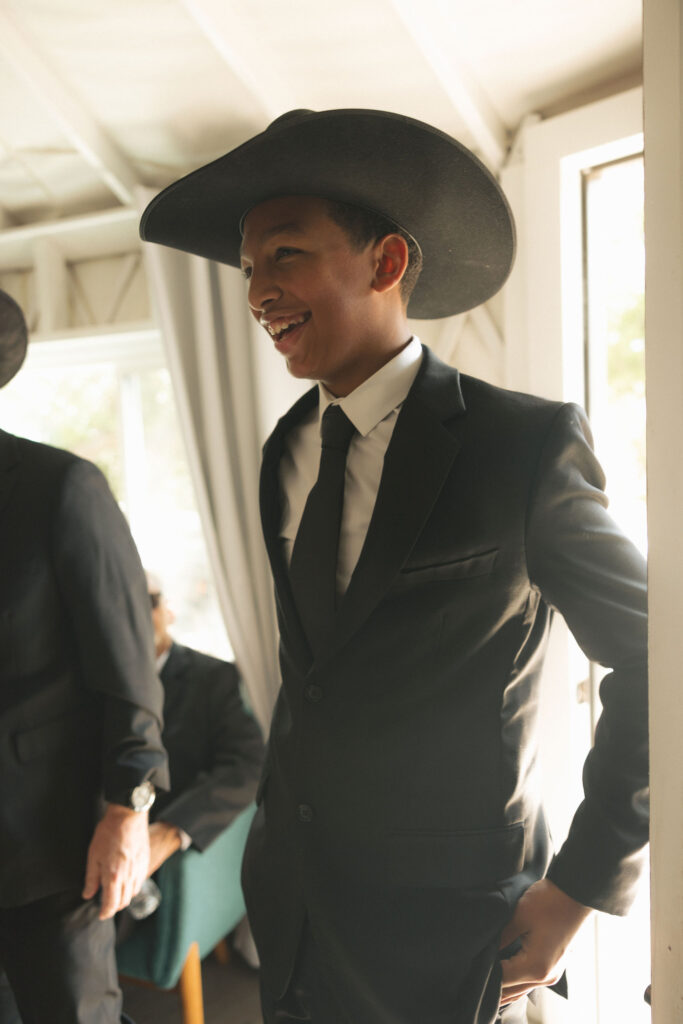 boy in hat during wedding
